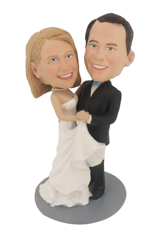 Custom bride and groom bobblehead on the dance floor